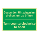 Gegen den Uhrzeigersinn drehen, /.../ - Turn counterclockwise to open