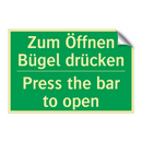 Zum Öffnen Bügel drücken - Press the bar to open