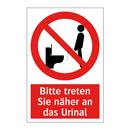 Bitte treten Sie näher an das Urinal