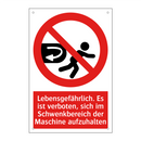 Lebensgefährlich. Es ist verboten, sich im Schwenkbereich der Maschine aufzuhalten