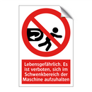 Lebensgefährlich. Es ist verboten, sich im Schwenkbereich der Maschine aufzuhalten