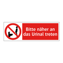 Bitte näher an das Urinal treten
