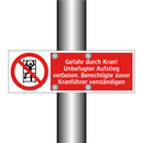 Gefahr durch Kran! Unbefugter Aufstieg verboten. Berechtigte zuvor Kranführer verständigen