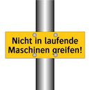 Nicht in laufende Maschinen greifen!