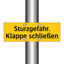 Sturzgefahr. Klappe schließen
