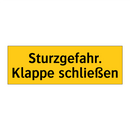 Sturzgefahr. Klappe schließen