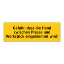 Gefahr, dass die Hand zwischen Presse und Werkstück eingeklemmt wird!