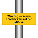 Warnung vor einem Fördersystem auf der Strecke