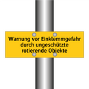 Warnung vor Einklemmgefahr durch ungeschützte rotierende Objekte