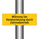 Warnung vor Handverletzung durch Zahnradantrieb