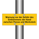 Warnung vor der Gefahr des Einklemmens der Hand zwischen Presse und Werkstück