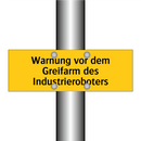 Warnung vor dem Greifarm des Industrieroboters