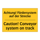 Achtung! Fördersystem auf der /.../ - Caution! Conveyor system on track/.../