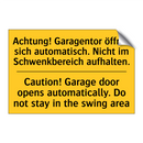 Achtung! Garagentor öffnet sich /.../ - Caution! Garage door opens automatically. /.../