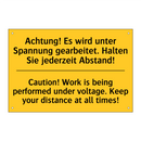 Achtung! Es wird unter Spannung /.../ - Caution! Work is being performed /.../