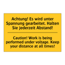 Achtung! Es wird unter Spannung /.../ - Caution! Work is being performed /.../