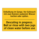 Entkalkung im Gange. Vor Gebrauch /.../ - Descaling in progress. Boil or /.../