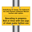 Entkalkung im Gange. Vor Gebrauch /.../ - Descaling in progress. Boil or /.../
