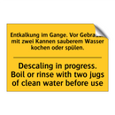 Entkalkung im Gange. Vor Gebrauch /.../ - Descaling in progress. Boil or /.../