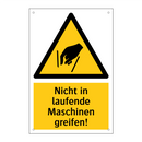 Nicht in laufende Maschinen greifen!