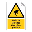 Nicht in laufende Maschinen greifen!
