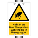 Nicht in die Maschine greifen, während sie in Bewegung ist.
