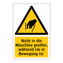 Nicht in die Maschine greifen, während sie in Bewegung ist.