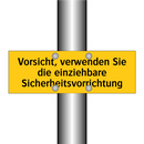 Vorsicht, verwenden Sie die einziehbare Sicherheitsvorrichtung