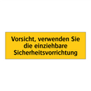 Vorsicht, verwenden Sie die einziehbare Sicherheitsvorrichtung