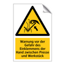 Warnung vor der Gefahr des Einklemmens der Hand zwischen Presse und Werkstück