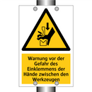 Warnung vor der Gefahr des Einklemmens der Hände zwischen den Werkzeugen