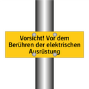 Vorsicht! Vor dem Berühren der elektrischen Ausrüstung