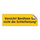 Vorsicht! Berühren Sie nicht die Schleifleitung!