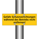 Gefahr Schutzvorrichtungen während des Betriebs nicht entfernen!